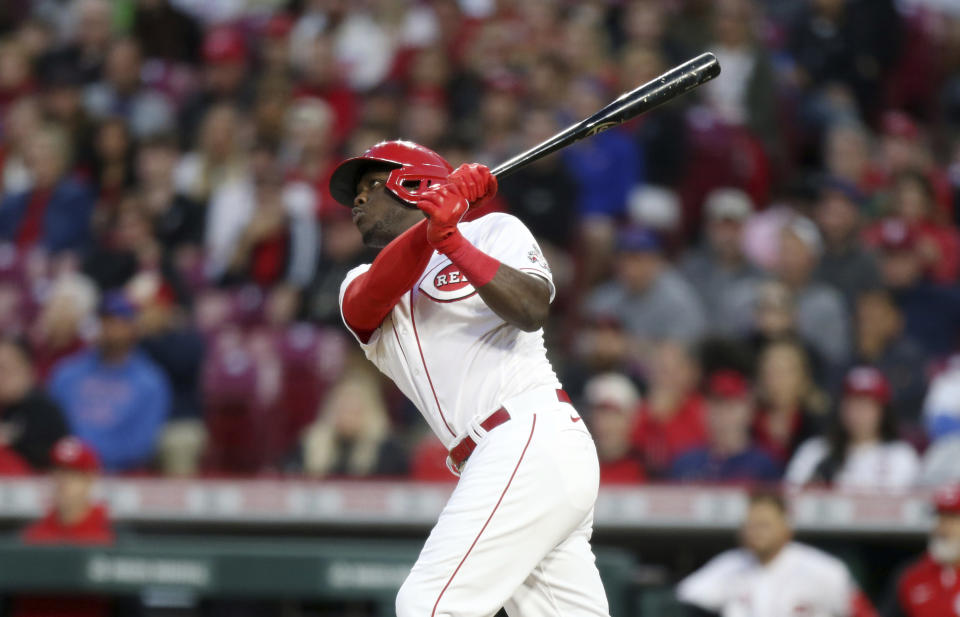 Cincinnati Reds' Aristides Aquino watches his two-run home run against the Chicago Cubs during the sixth inning of a baseball game in Cincinnati, Monday, May 23, 2022. (AP Photo/Paul Vernon)