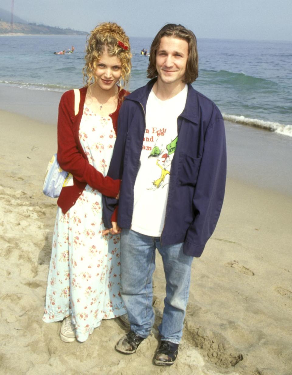 <p>In keeping with his on-screen character Travis, Meyer opted for jeans, a "Green Eggs and Ham" t-shirt, and an oversized jacket for the celebration on the beach. Here he is posing on the sand with screenwriter and director Deborah Kaplan. </p>