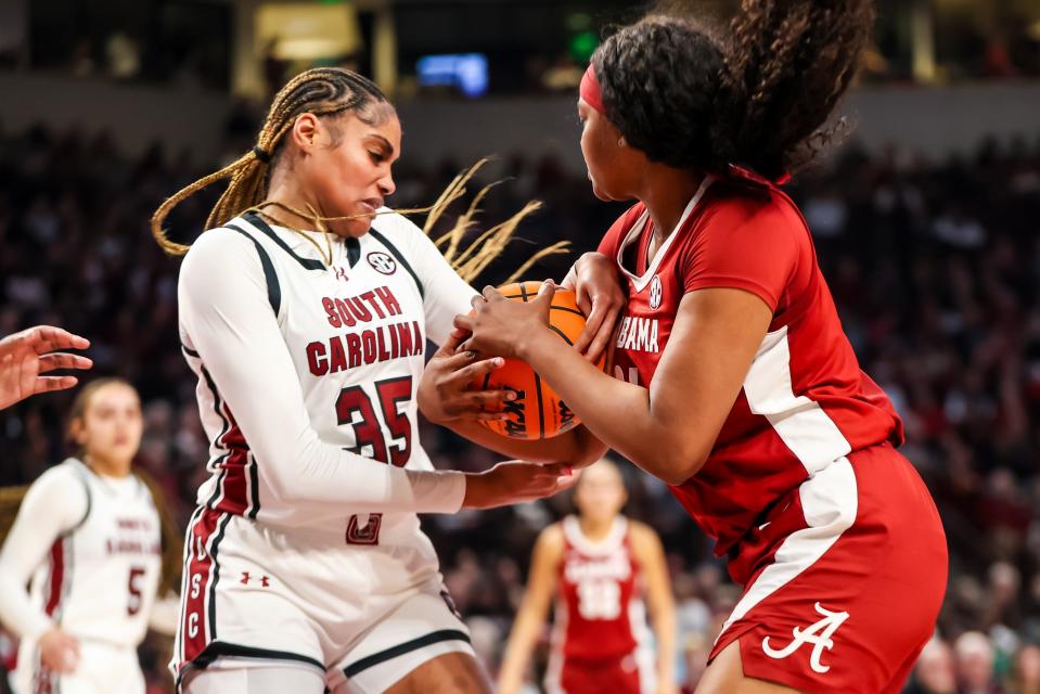 Feb 22, 2024; Columbia, South Carolina, USA; South Carolina Gamecocks center Sakima Walker (35) and Alabama Crimson Tide forward Essence Cody (21) battle for the ball in the second half at Colonial Life Arena. Mandatory Credit: Jeff Blake-USA TODAY Sports