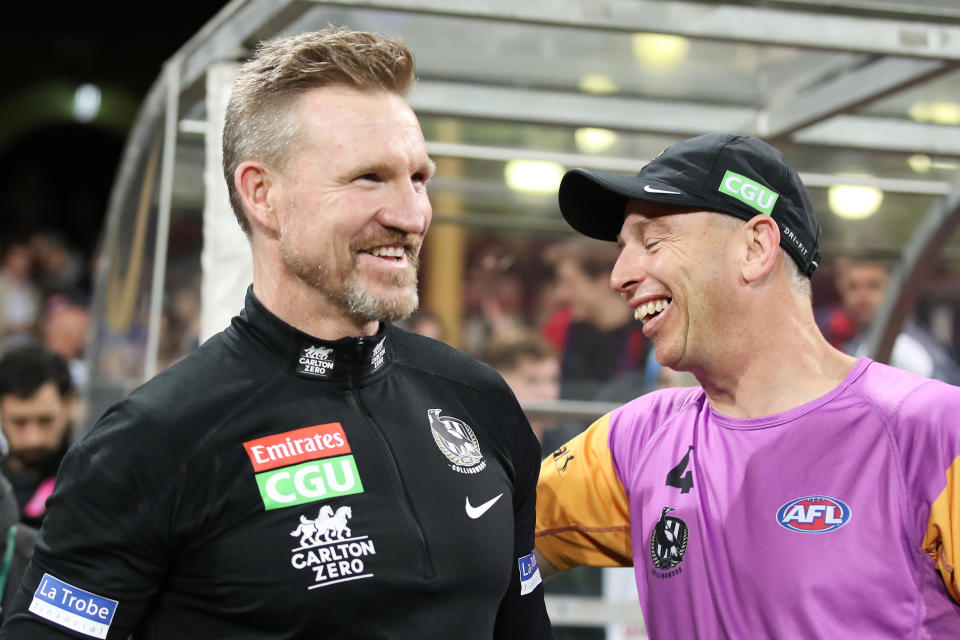 SYDNEY, AUSTRALIA - JUNE 14: Magpies head coach Nathan Buckley celebrates victory with Magpies staff after coaching his final match for the Magpies during the round 13 AFL match between the Melbourne Demons and the Collingwood Magpies at Sydney Cricket Ground on June 14, 2021 in Sydney, Australia. (Photo by Matt King/Getty Images)