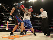 <p>Robert Marzano (red) and Jafet Sori (blue) mix it up in the TD1 ATU Grudge Match at the NYPD Boxing Championships at the Hulu Theater at Madison Square Garden on March 15, 2018. (Gordon Donovan/Yahoo News) </p>