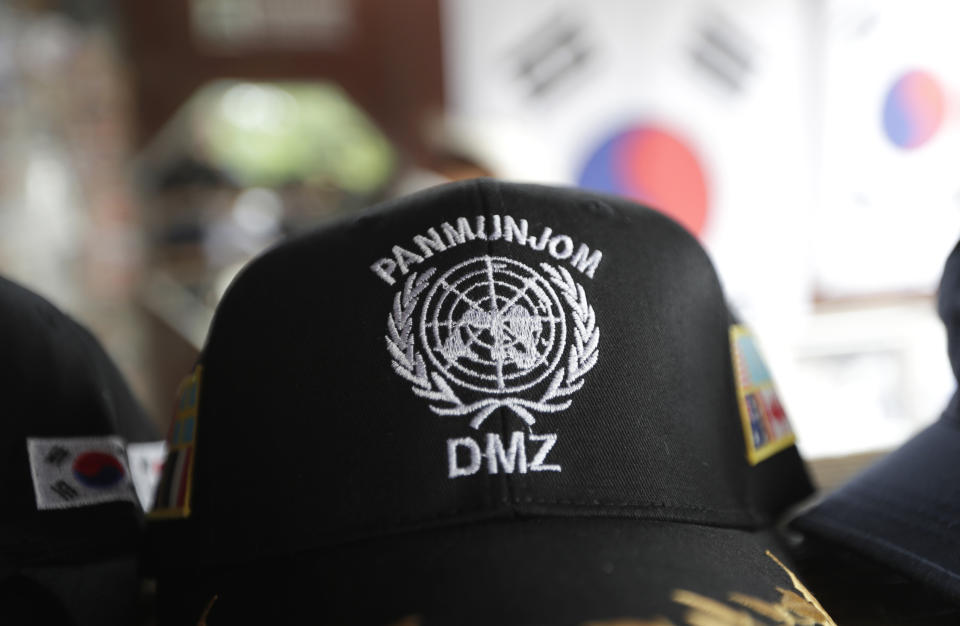 A cap showing letters of Panmunjom and Demilitarized Zone, is placed at a souvenir shop at the Imjingak Pavilion in Paju, South Korea, Sunday, June 30, 2019. U.S. President Donald Trump said Sunday he believes North Korean leader Kim Jong Un wants to meet for a handshake at the Demilitarized Zone separating the North and South, a day after issuing the unprecedented invitation and expressing willingness to cross the border for what would be a history-making photo op. (AP Photo/Lee Jin-man)