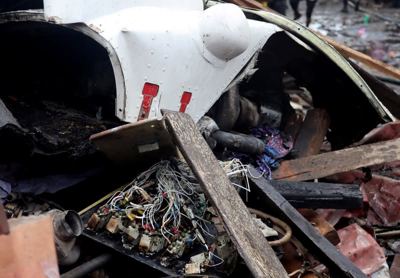 The wreckage of a Dornier 228-200 plane operated by local company Busy Bee is seen at a crash site in Goma