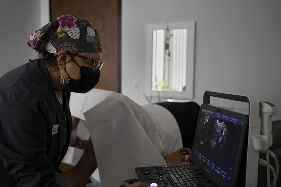 Glenda Lima performs an ultrasound for a patient at Houston Women's Reproductive Services. (Danielle Villasana for The Washington Post)