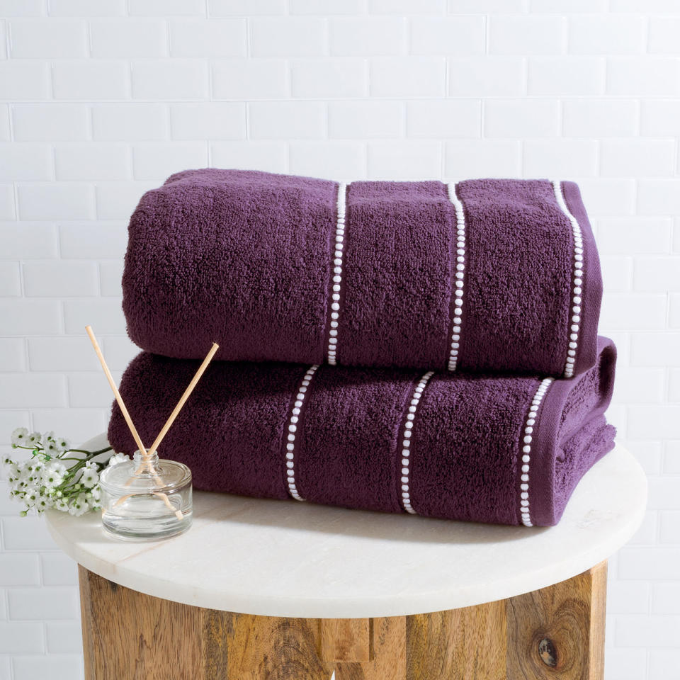 Get the cotton-towel set <a href="https://www.pier1.com/purple-%26-white-luxury-cotton-towel-set-of-2/3489780.html" target="_blank">here</a>.