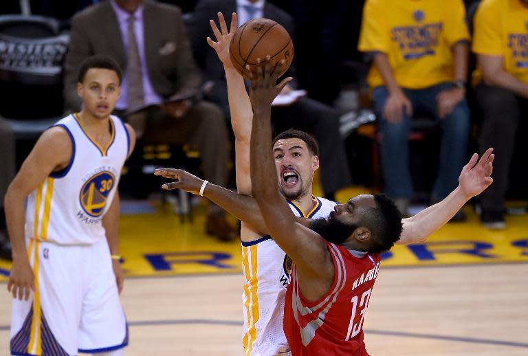 Klay Thompson of the Golden State Warriors blocks the shot of James Harden (R) of the Houston Rockets during Game Two of the Western Conference Finals of the NBA Playoffs at ORACLE Arena on May 21, 2015 in Oakland, California