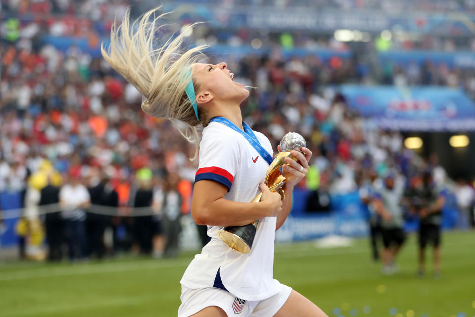 LYON, FRANCE - JULY 07: Julie Ertz of the USA celebrates with the FIFA Women's World Cup Trophy following her team's victory in the 2019 FIFA Women's World Cup France Final match between The United States of America and The Netherlands at Stade de Lyon on July 07, 2019 in Lyon, France. (Photo by Catherine Ivill - FIFA/FIFA via Getty Images)