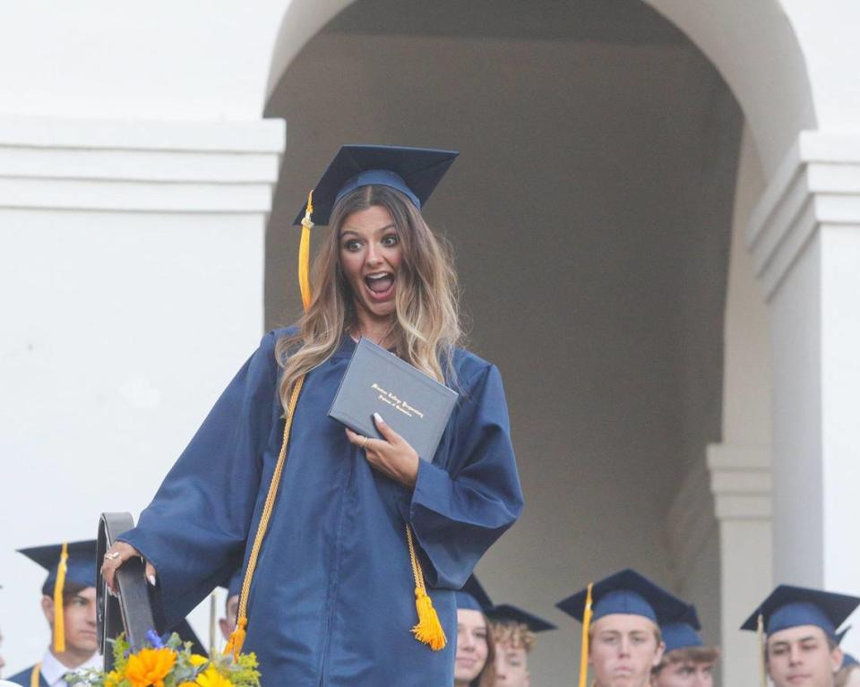 Madeline Sean celebrates her diplom as Mission Prep graduated 61 students on the steps of Mission San Luis Obispo on Friday, June, 2, 2023.