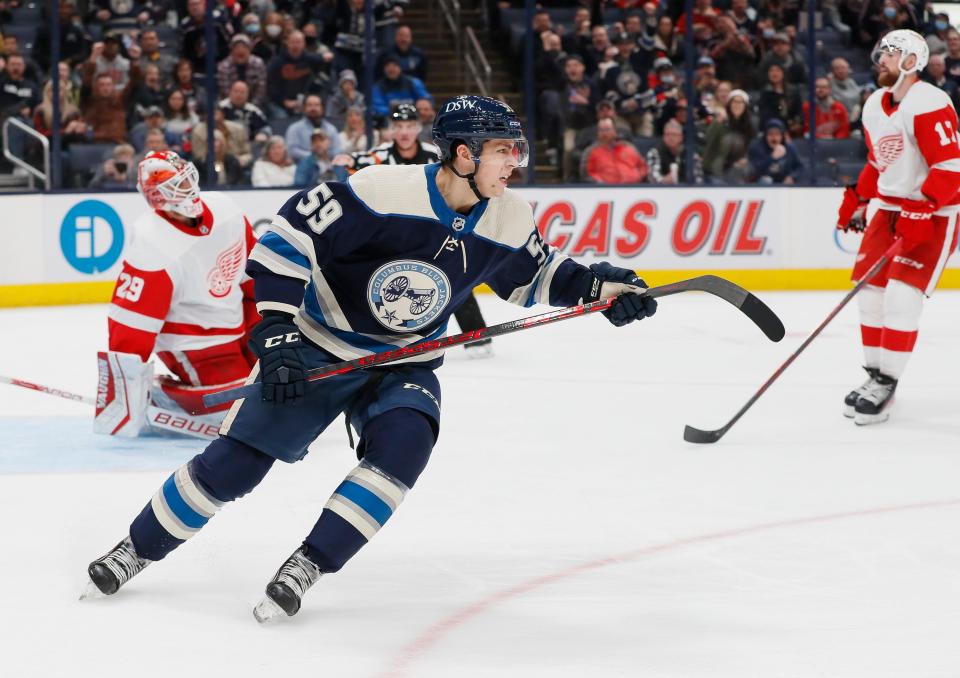 Columbus Blue Jackets right wing Yegor Chinakhov (59) twirls his stick as he celebrates scoring his first NHL goal during the third period of the hockey game against the Detroit Red Wings at Nationwide Arena in Columbus on Monday, Nov. 15, 2021. The Blue Jackets won 5-3.