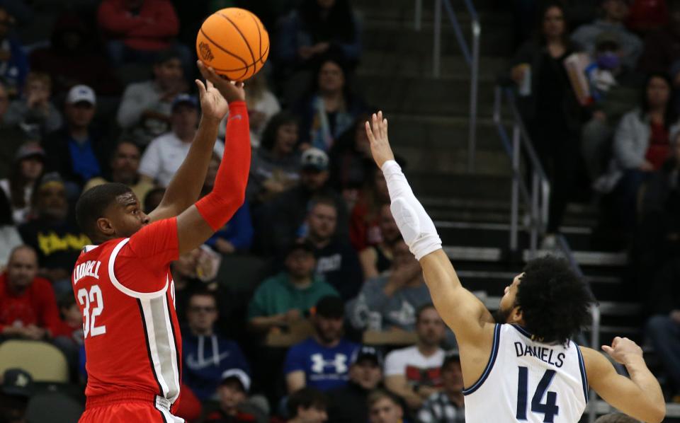 Ohio State's E.J. Liddell shoots against Villanova's Caleb Daniels on Sunday.