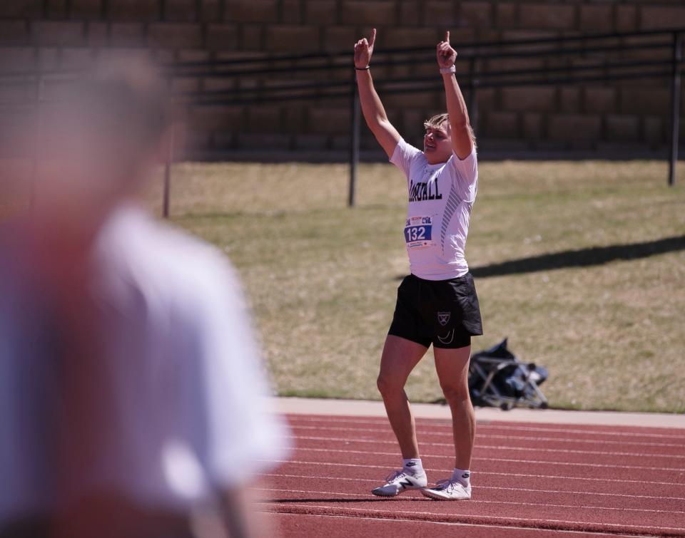 Randall’s Nathan Baker gestures after placing first in the Region I-4A 100 meter dash, Saturday, April 29, 2023, at Lowrey Field. 