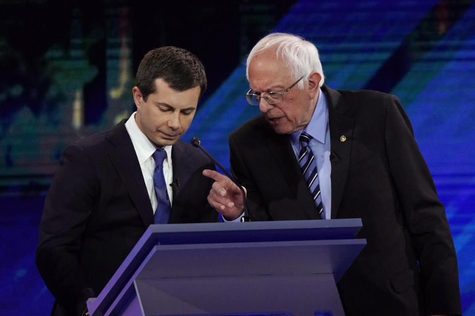 Democratic presidential candidates South Bend Mayor Pete Buttigieg, left and Sen. Bernie Sanders, I-Vt., talk during a break Thursday, Sept. 12, 2019, during a Democratic presidential primary debate hosted by ABC at Texas Southern University in Houston. (AP Photo/David J. Phillip)