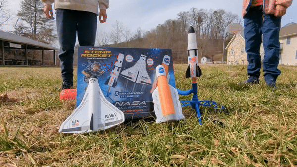 children stomp on a plastic bladder, sending foam rockets some 50 feet into the air