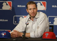 FILE - In this Dec. 9, 2013, file photo, two-time Cy Young Award winner Roy Halladay answers questions after announcing his retirement after 16 seasons in the major leagues with Toronto and Philadelphia at the Major League Baseball winter meetings in Lake Buena Vista, Fla. The late Roy Halladay will be inducted into the Baseball Hall of Fame on Sunday, July 21, 2019. (AP Photo/John Raoux, File)