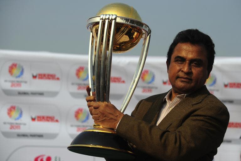 Former Bangladesh Cricket Board president Mustafa Kamal holds the World Cup Cricket trophy during its arrival on flight from India at the Shahjalal International Airport in Dhaka on February 3, 2011