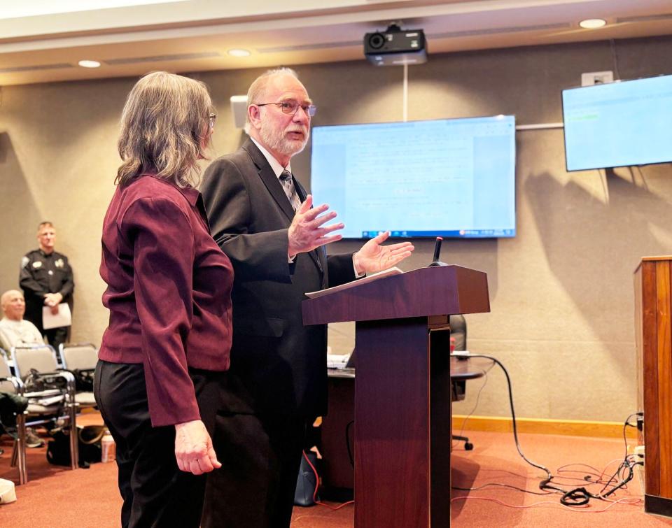 Jack Suggs, with his wife Joan at his side, speaks at the March meeting of Oak Ridge City Council in the Municipal Building. Council approved and presented Suggs with a proclamation honoring him for his service to the city. Suggs, who is retiring, worked as Electric Department director and deputy city manager.