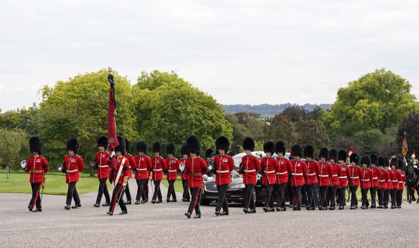 Soldiers escort the State Hearse as it arrives at Windsor Castle carrying the coffin of Queen Elizabeth II