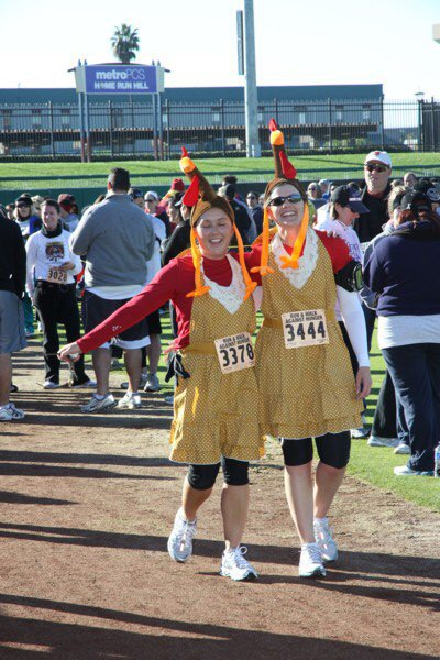 Costumed as holiday turkeys, two participants in Run and Walk Against Hunger.