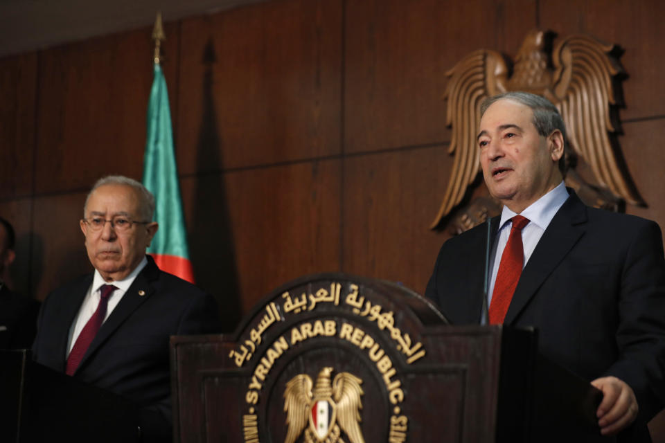 Syrian Foreign Minister Faisal Mekdad, right, speaks during a joint press conference with Algerian Foreign Minister Ramtane Lamamra in Damascus, Syria, Monday, July 25, 2022. Lamamra on Monday decried Syria's decade-long suspension from the Arab League, and hinted at supporting their return to the organization, during a visit in Damascus. (AP Photo/Omar Sanadik)