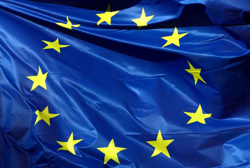 FILE PHOTO: A European Union flag flutters outside the EU Commission headquarters in Brussels