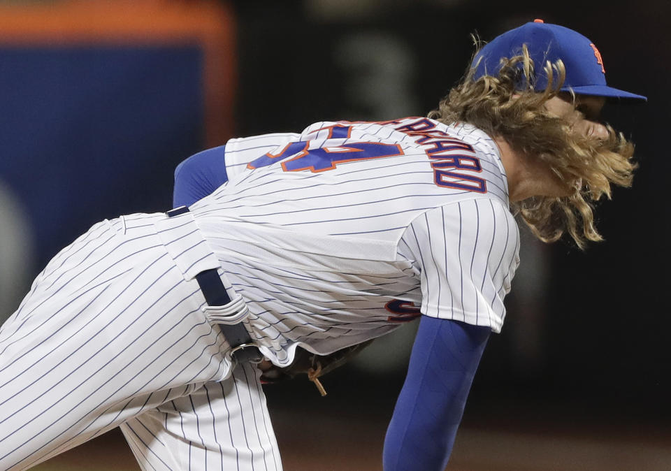 New York Mets pitcher Noah Syndergaard (34) delivers against the Miami Marlins during the first inning of a baseball game, Sunday, April 9, 2017, in New York. (AP Photo/Julie Jacobson)