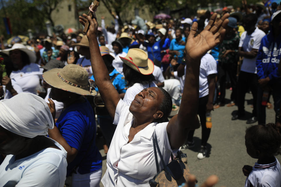 Faithful take part in a Good Friday procession in Port-au-Prince, Haiti, Friday, April 7, 2023. Holy Week commemorates the last week of the earthly life of Jesus Christ culminating in his crucifixion on Good Friday and his resurrection on Easter Sunday. (AP Photo/Odelyn Joseph)