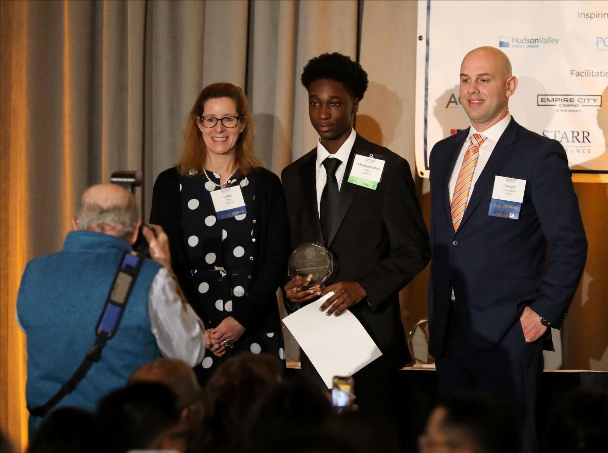 Mouhamadou Alou with Mount Vernon High School, center, was presented with the Youth Leadership Award as Volunteer New York! held their 44th Annual Volunteer Spirit Awards, presented by Regeneron, at the Westchester Marriott in Tarrytown, April 12, 2024. The award was presented by PKF O'Connor Davies, LLP