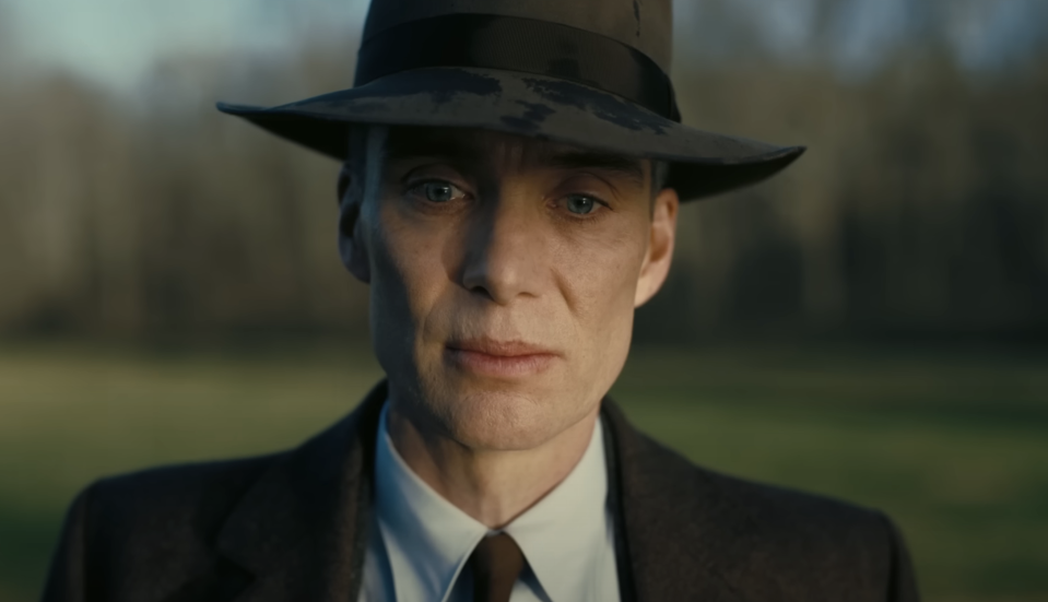 A closeup of Oppenheimer wearing a fedora