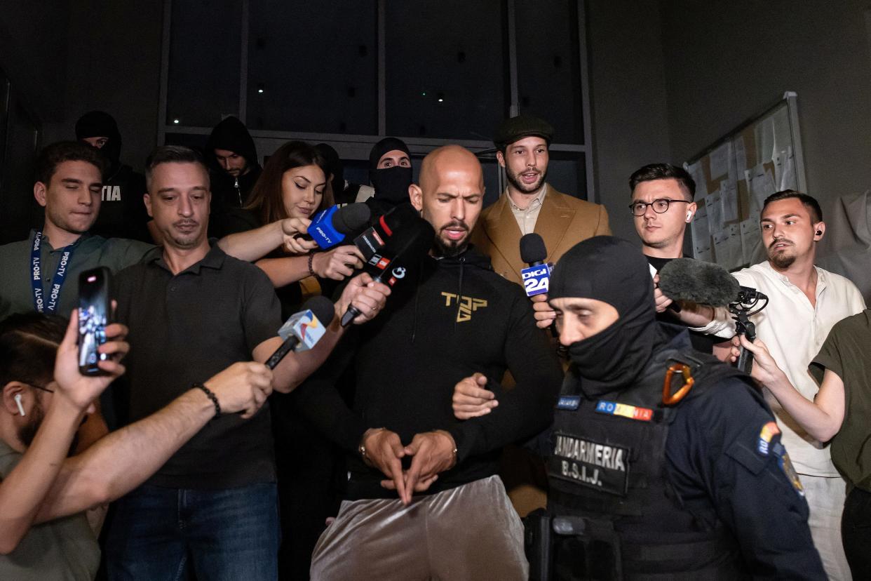 Andrew Tate and his brother Tristan are escorted outside the Directorate for Investigating Organized Crime and Terrorism (DIICOT), in Bucharest, Romania, August 21, 2024.