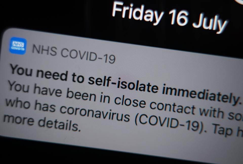 A self-isolate message on the NHS Covid-19 app (PA Wire)