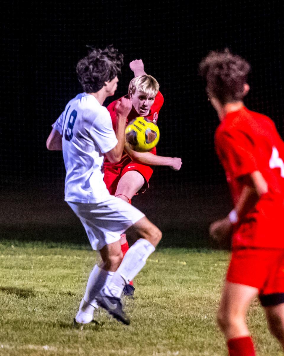 Old Rochester's Ryan Blanchette clears the ball away to George Psichopaidas (4).