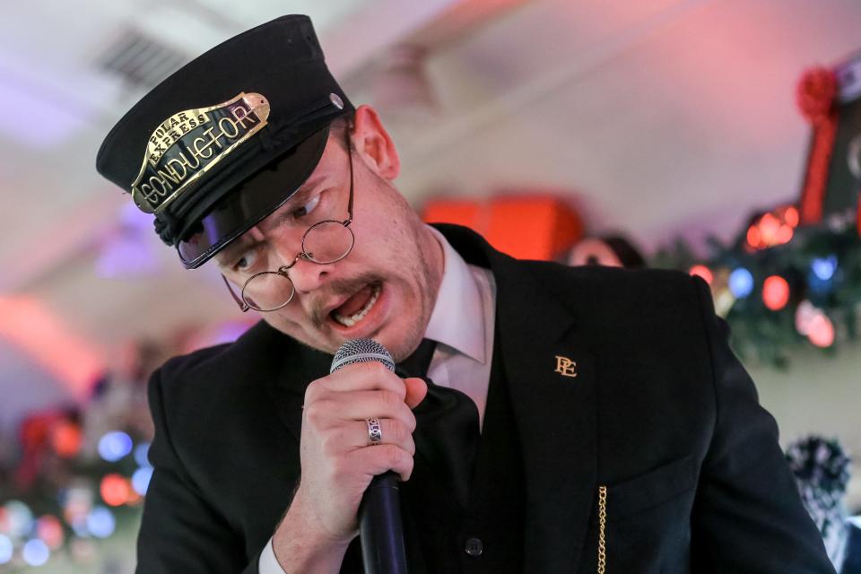 An actor playing the Conductor visits passengers on "The Polar Express Train Ride," which runs out of the Oklahoma Railway Museum in Oklahoma City.