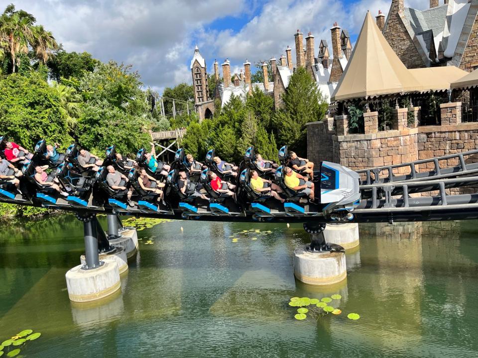 Jurassic Park meets Harry Potter: The Velocicoaster zips past the Wizarding World of Harry Potter at Universal Orlando Resort's Islands of Adventure.