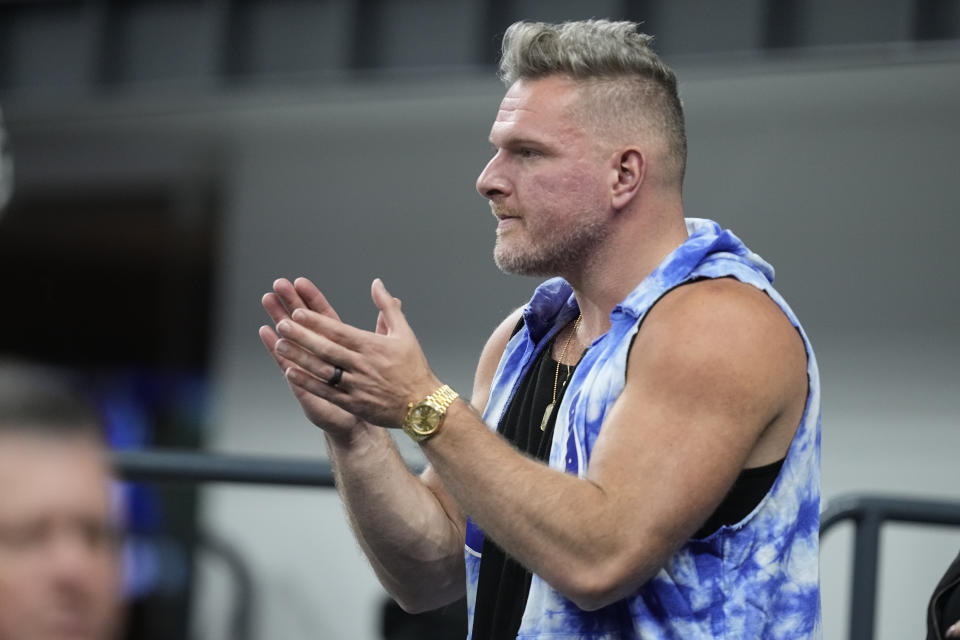Sports analyst Pat McAfee watches an NFL football game between the Indianapolis Colts and the Houston Texans, Saturday, Jan. 6, 2024, in Indianapolis. (AP Photo/Darron Cummings)