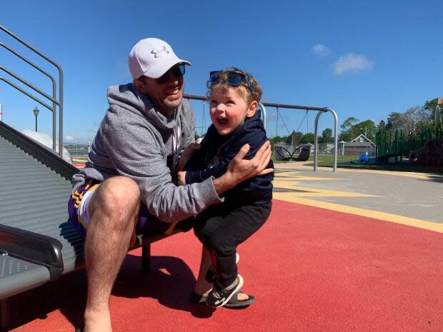 Jeff Perry and his two-year-old son, Micah, spent part of Father's Day at the playground at Victoria Park in Charlottetown. Perry's wife, Jane, gave birth to their second son, Ezra, four days ago. (Shane Ross/CBC - image credit)