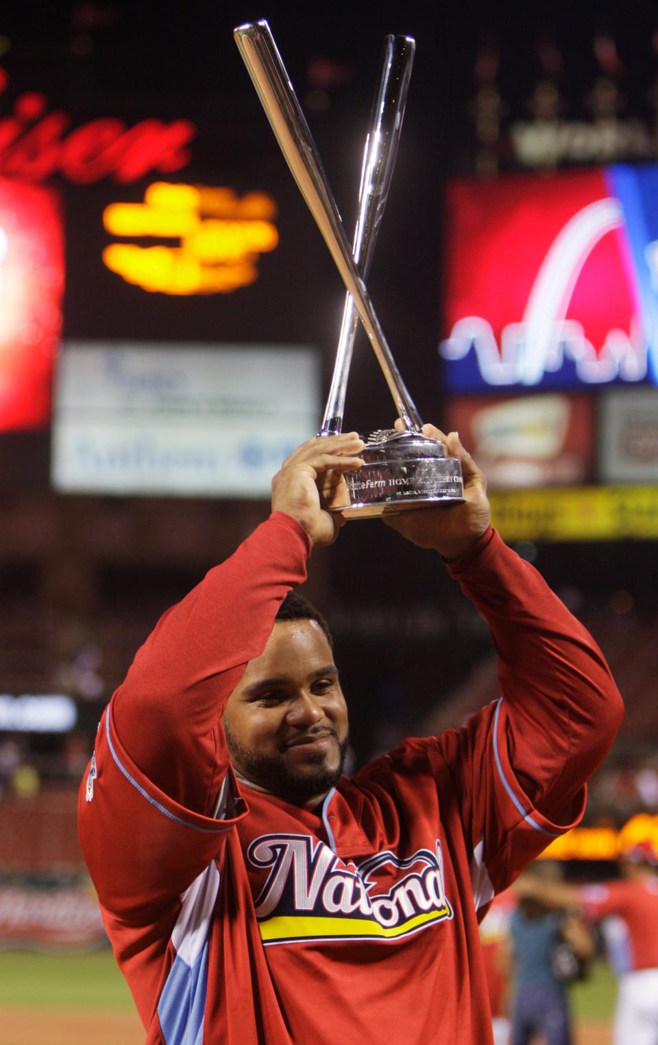 National League's Prince Fielder of the Milwaukee Brewers holds his trophy after winning the MLB Home Run Derby in St. Louis on July 13, 2009.