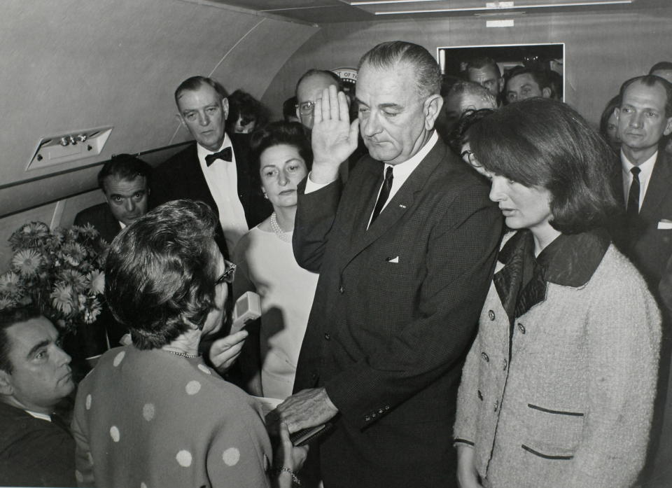 - PHOTO TAKEN 22NOV1963 - U.S. Vice President Lyndon Baines Johnson (C) takes the presidential oath of office from Judge Sarah T. Hughes (2nd from L) as President John F. Kennedy's widow first lady Jacqueline Bouvier Kennedy (2nd from R) stands at his side aboard Air Force One at Love Field in Dallas, Texas just two hours after Kennedy was shot in this November 22, 1963 photo by White House photographer Cecil Stoughton provided by the John F. Kennedy Presidential Library in Boston. Attending the swearing in are Assistant Presidential Press Secretary Malcolm Kilduff (L-front), Special Assistant to the President Jack Valenti (L-Rear), U.S. Congressman Albert Thomas (2nd from L-Rear) and U.S. Congressman Jack Brooks (Far R). The fortieth anniversary of Kennedy's assassination will be on November 22, 2003. 
&W ONLY
??? USE ONLY
(Credit :JFK Library/Cecil Stoughton/The White House)