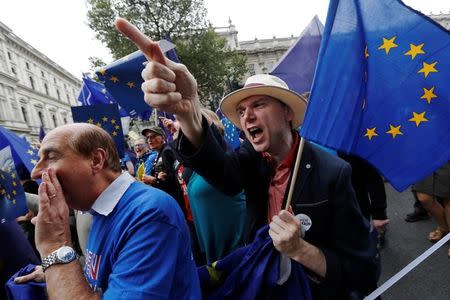 Pro-Europe demonstrators react to Brexit supporters on route during a "March for Europe" protest against the Brexit vote result earlier in the year, in London, Britain, September 3, 2016. REUTERS/Luke MacGregor