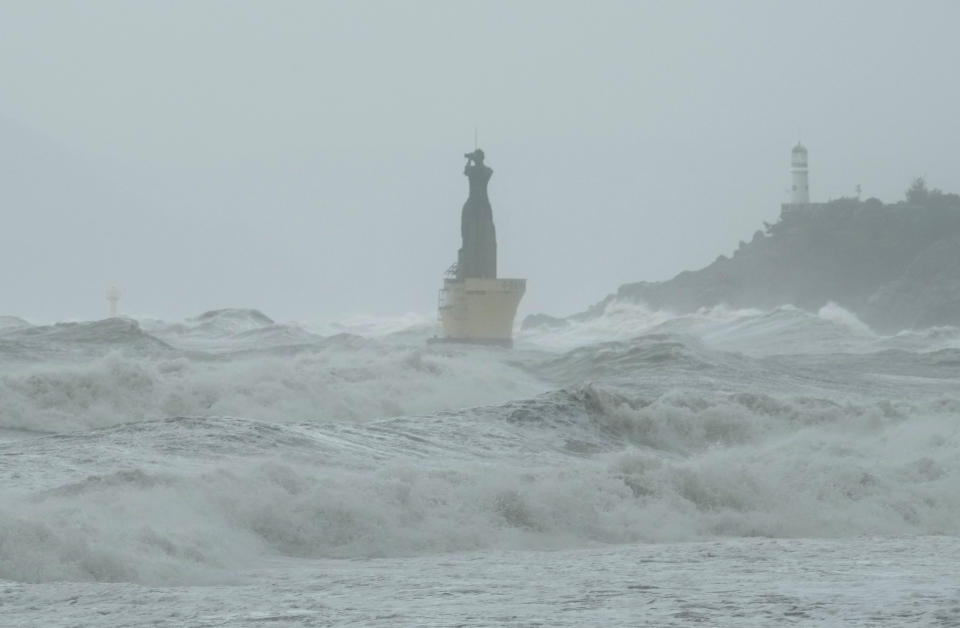 High waves crash a shore as the tropical storm named Khanun approaches to the Korean Peninsular, in Busan, Thursday, Aug. 10, 2023. (AP Photo/Ahn Young-joon)