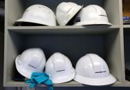 FILE PHOTO: Helmets line a shelf in a control room at Kinder Morgan's Westridge Terminal on Burrard Inlet in Burnaby