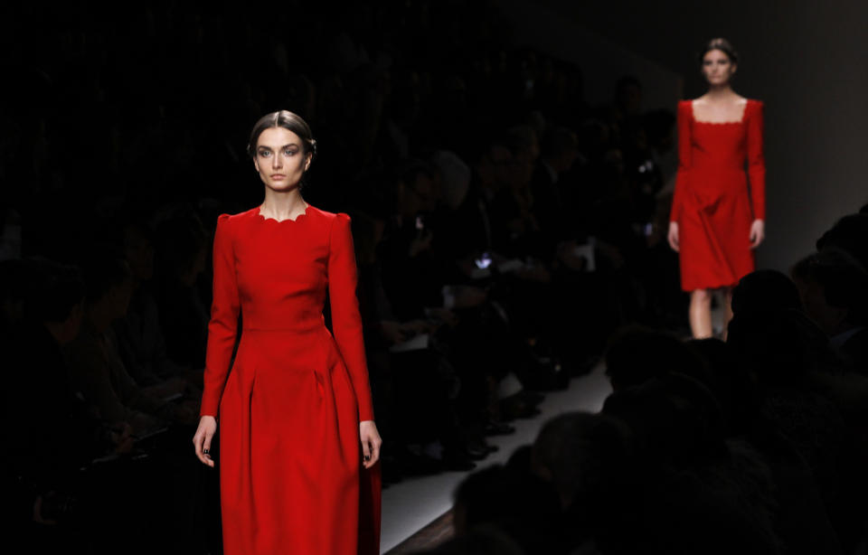 Models wear creations by Maria Grazia Chiuri and Pier Paolo Piccioli for Valentino as part of the Fall-Winter, ready-to-wear 2013 fashion collection, during Paris Fashion week, Tuesday, March. 6, 2012. (AP Photo/Christophe Ena)