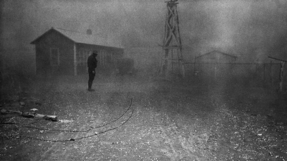 Farmer stands in a dust storm in New Mexico, Spring 1935.