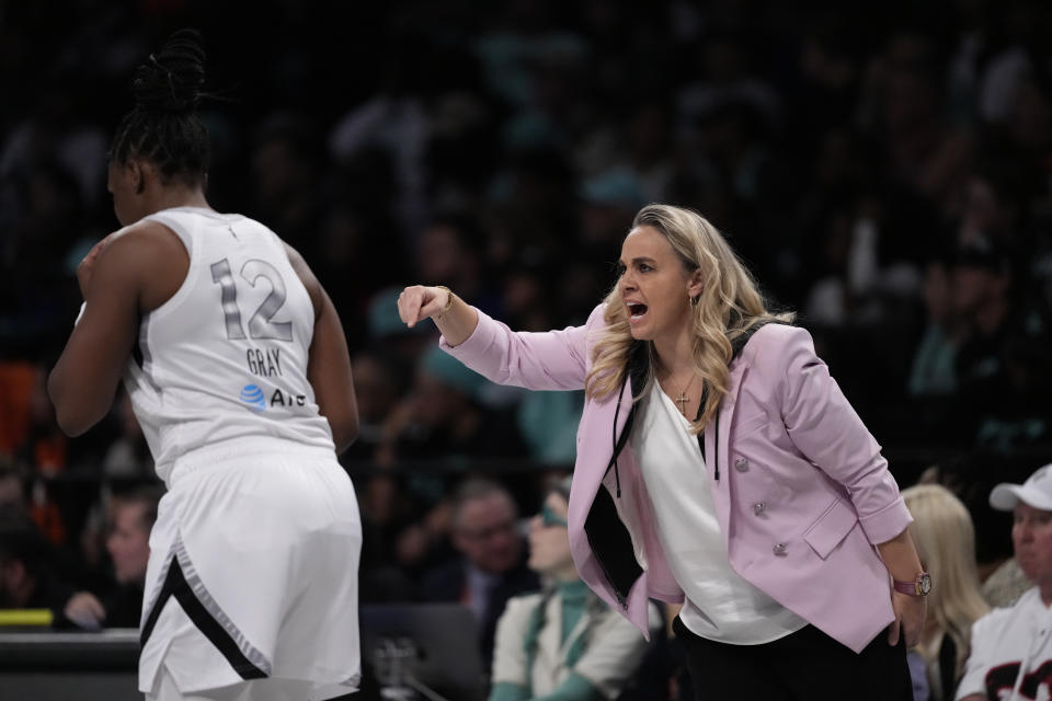 New York Liberty head coach Becky Hammon during the first half of a WNBA basketball semifinal game against the New York Liberty, Tuesday, Oct. 1, 2024, in New York. (AP Photo/Frank Franklin II)