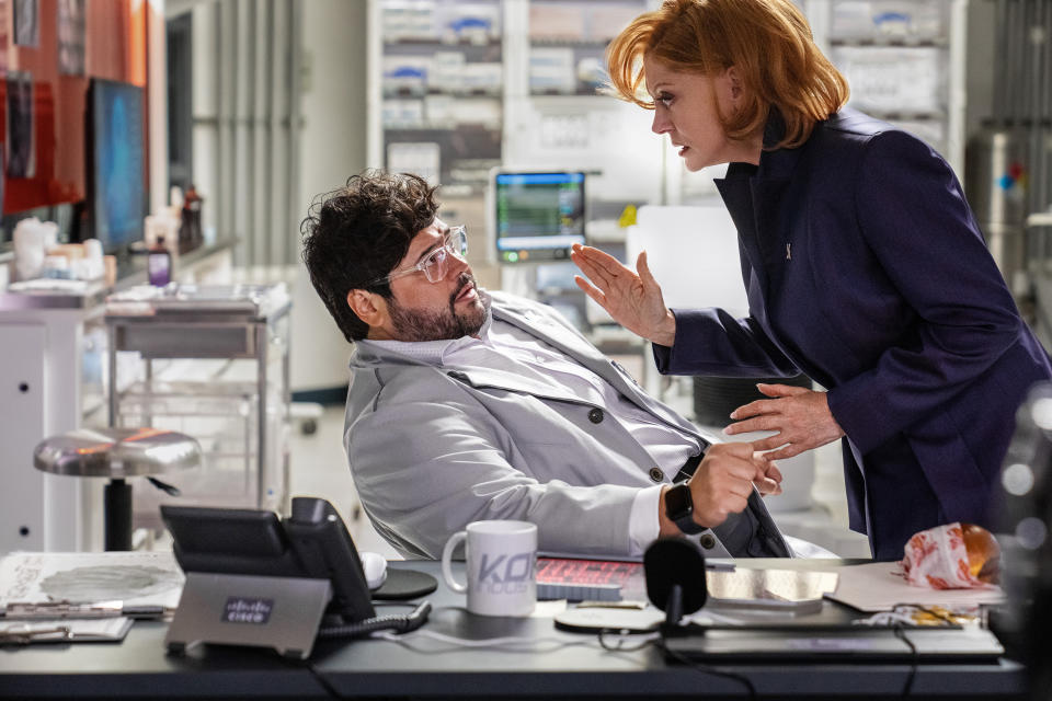 This image released by Warner Bros. Pictures shows Javier Guillen, left, and Susan Sarandon in a scene from "Blue Beetle." (Warner Bros. Pictures via AP)