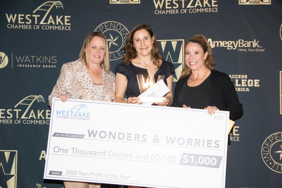 Nicole Halder, center, the director of strategic outreach at Wonders & Worries, poses at the 2020 Westies award ceremony with award sponsor Teri Evans, left, the owner of Hand & Stone Massage and Facial Spa, and the 2019 winner Dana Delorenzo, at right, from the Eanes Education Foundation.