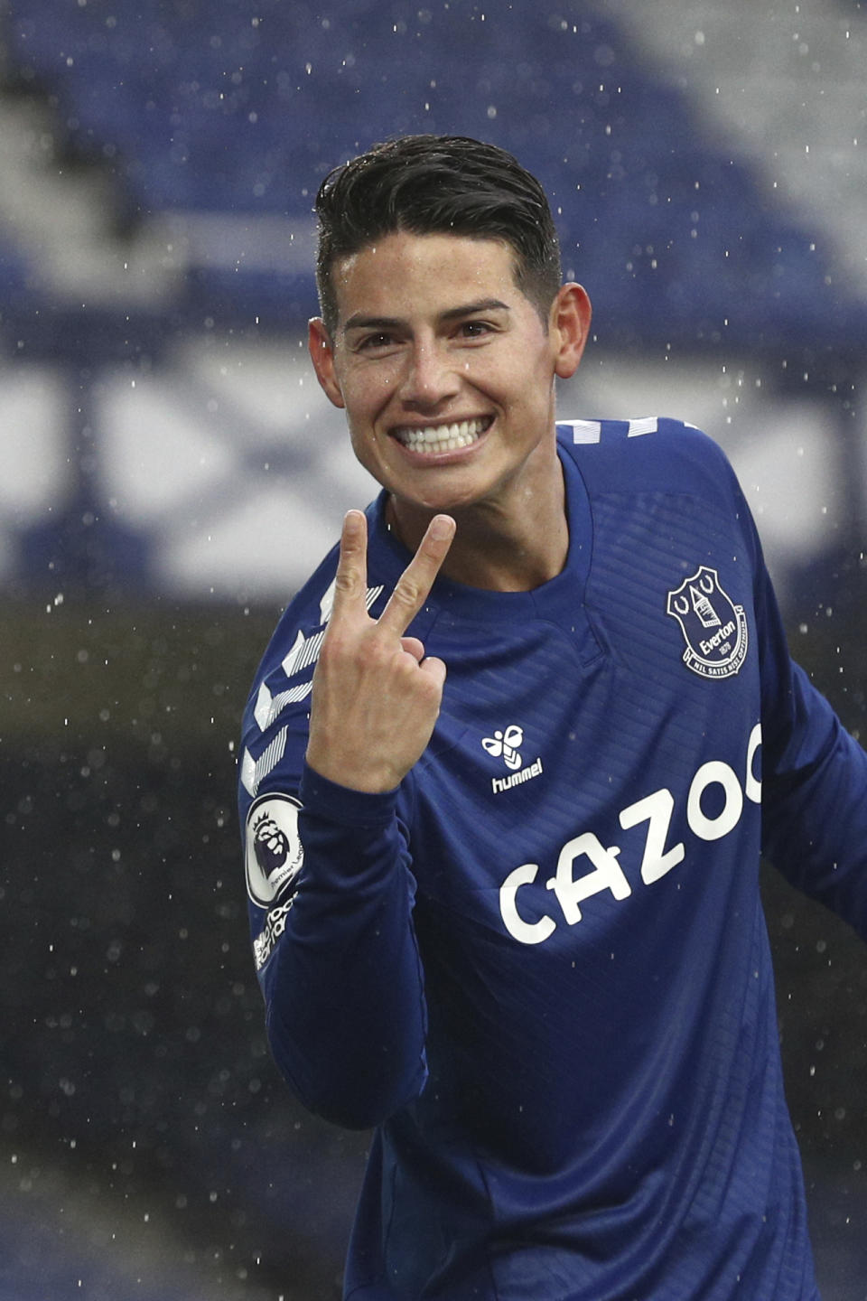 Everton's James Rodriguez celebrates after scoring his side's fourth goal during the English Premier League soccer match between Everton and Brighton at the Goodison Park stadium in Liverpool, England, Saturday, Oct. 3, 2020. (Jan Kruger/Pool via AP)
