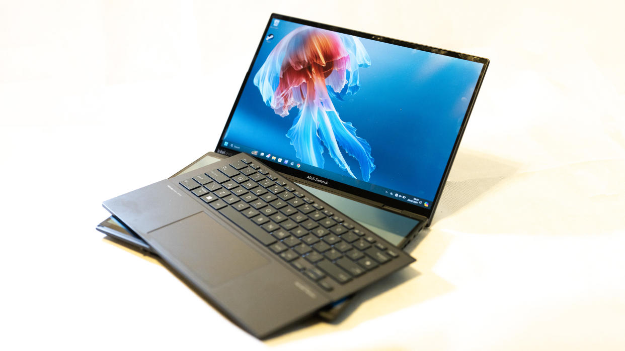  An ASUS Zenbook Duo OLED 2024 laptop on a white table. 