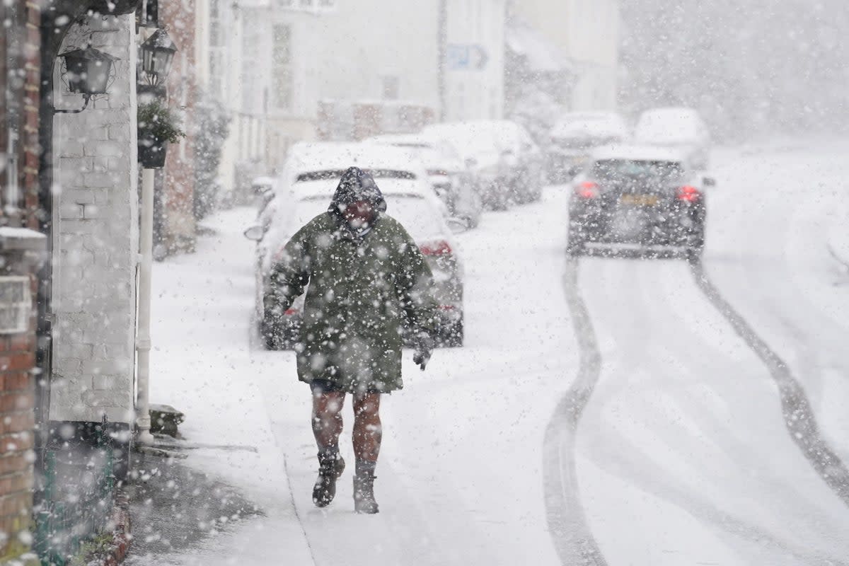 A person walking through a snow flurry in Lenham, Kent, on Monday (Gareth Fuller/PA) (PA Wire)