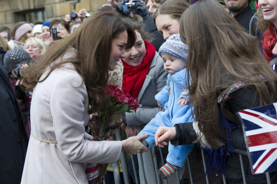 Kate meets 5 month-old James William Davies, who was named after Prince William, and his mother Tessa Davies in the Market Square, in Cambridge (Getty)