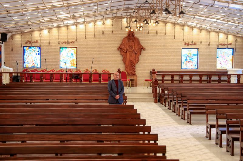 Thanoun Yahya, a 59 year-old an Iraqi Christian from the city of Mosul, stands at Al-Bishara church in Mosul